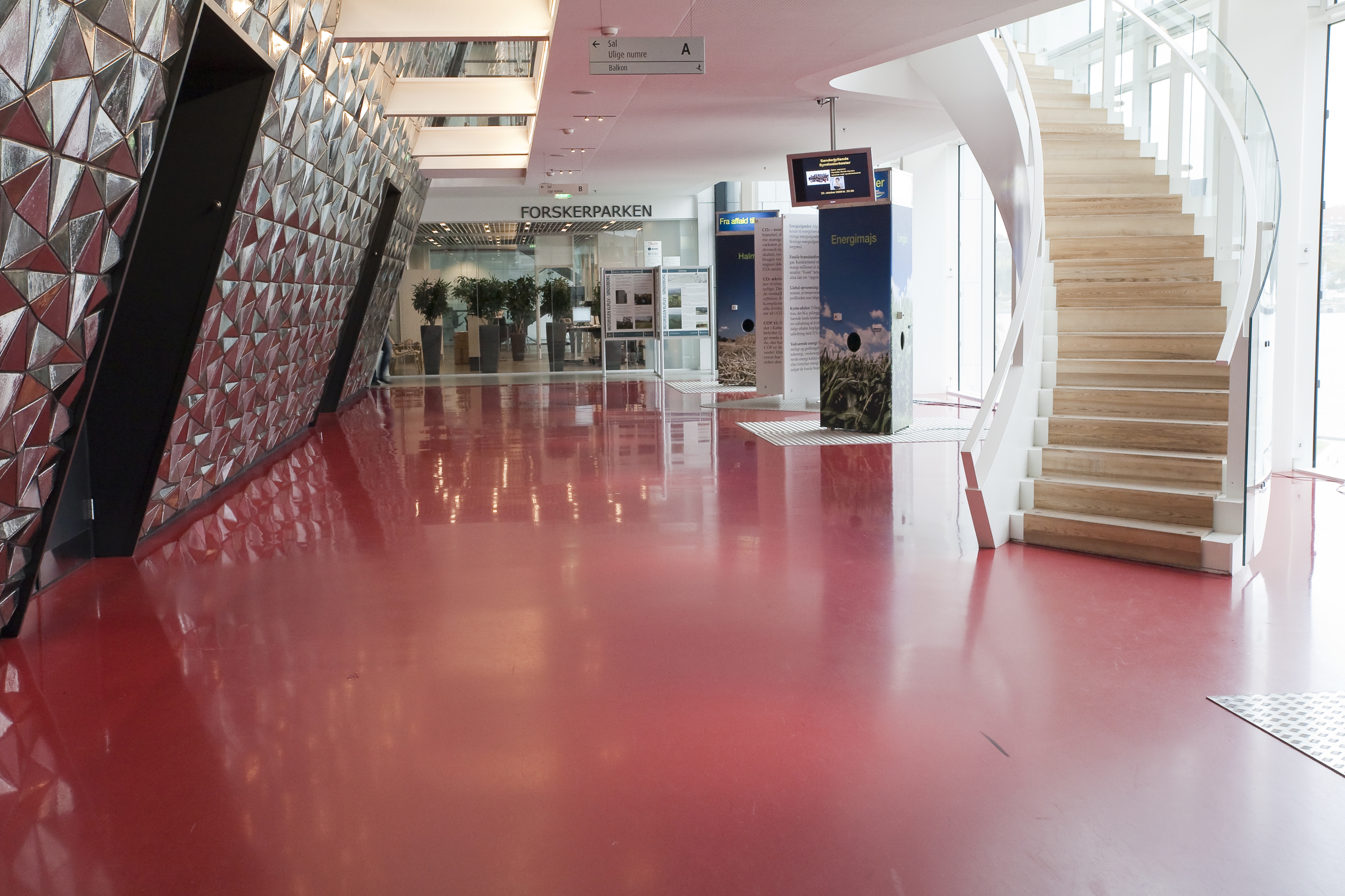 Red foyer area with staircase in Alsion